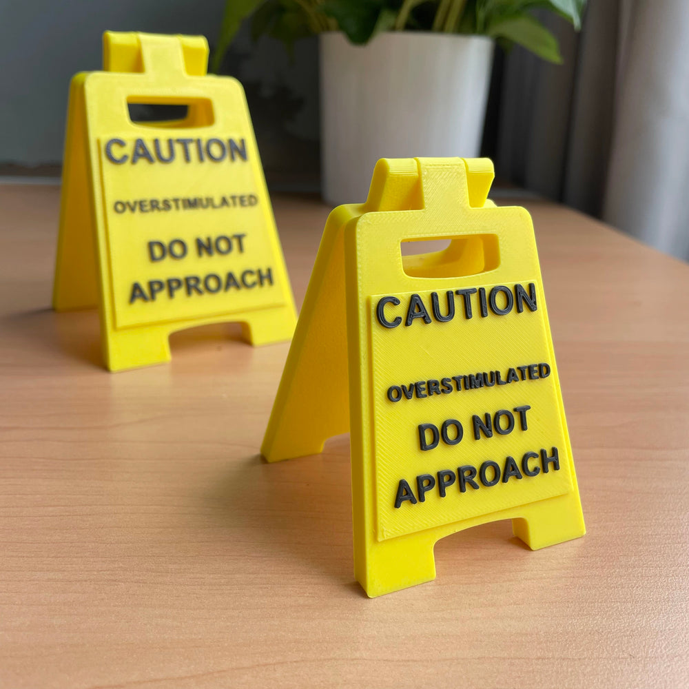 Caution Overstimulated Sign for Desk - Yellow Sign with Black Text, Warning Message for Safety Awareness
