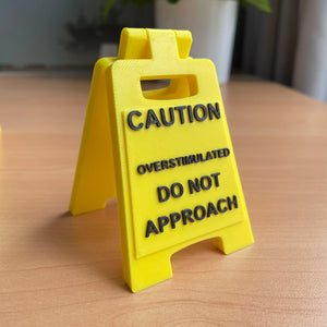 Caution Overstimulated Sign for Desk - Yellow Sign with Black Text, Warning Message for Safety Awareness