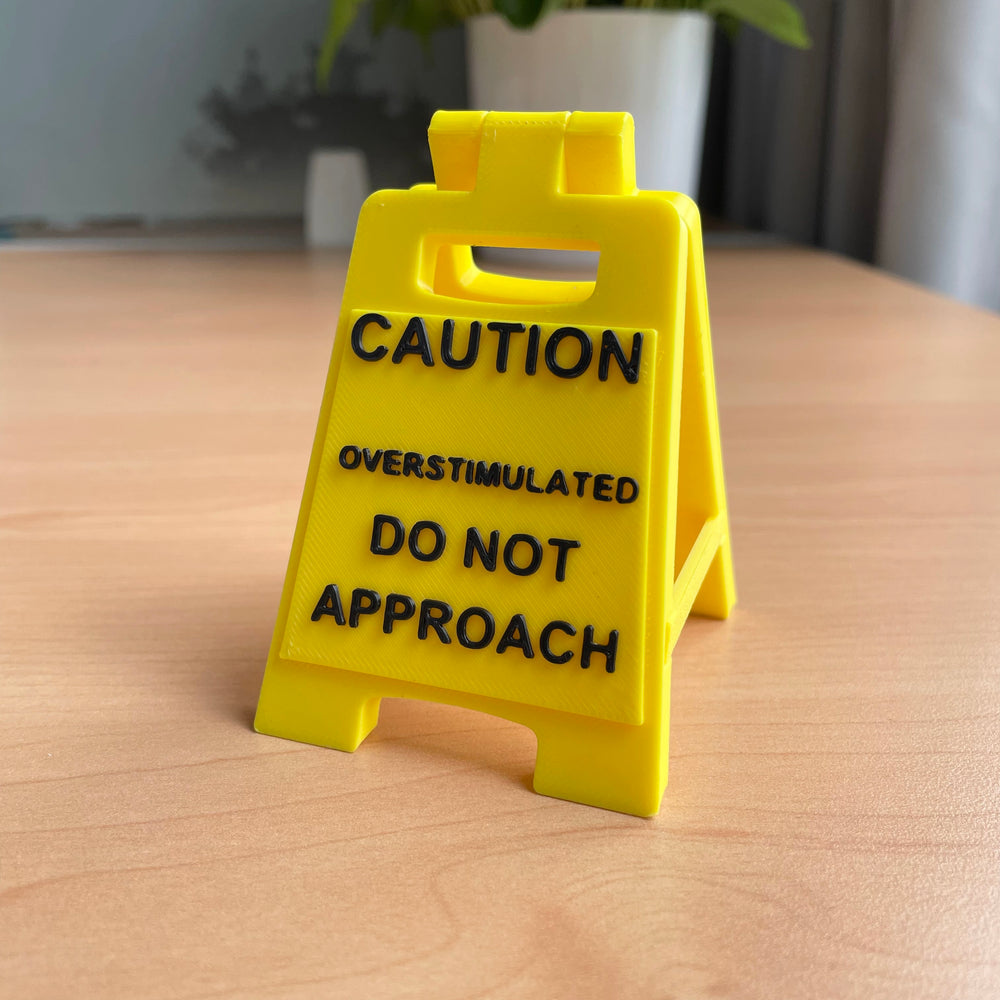 Caution Overstimulated Sign for Desk - Yellow Sign with Black Text, Warning Message for Safety Awareness