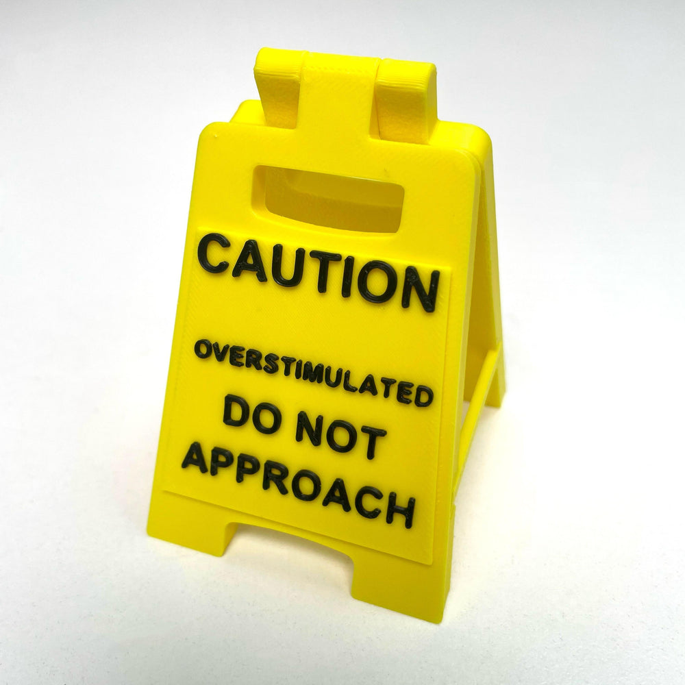 Caution Overstimulated Sign for Desk - Yellow Sign with Black Text, Warning Message for Safety Awareness